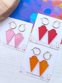 Glitter jellie hoop earrings in red, pink and orange on a 'The Messy Brunette' jewellery branded cards