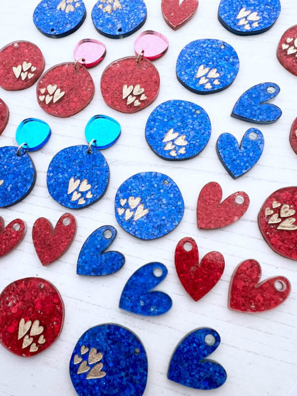 Colorful heart and round earrings
 on a white background
