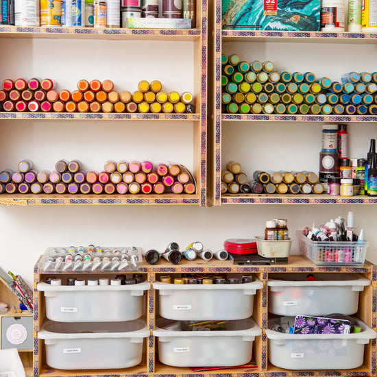 paints pot as lined up on a shelf