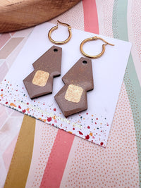Taupe brown earrings with gold accents on a colourful card with 'The Messy Brunette' jewellery branding card