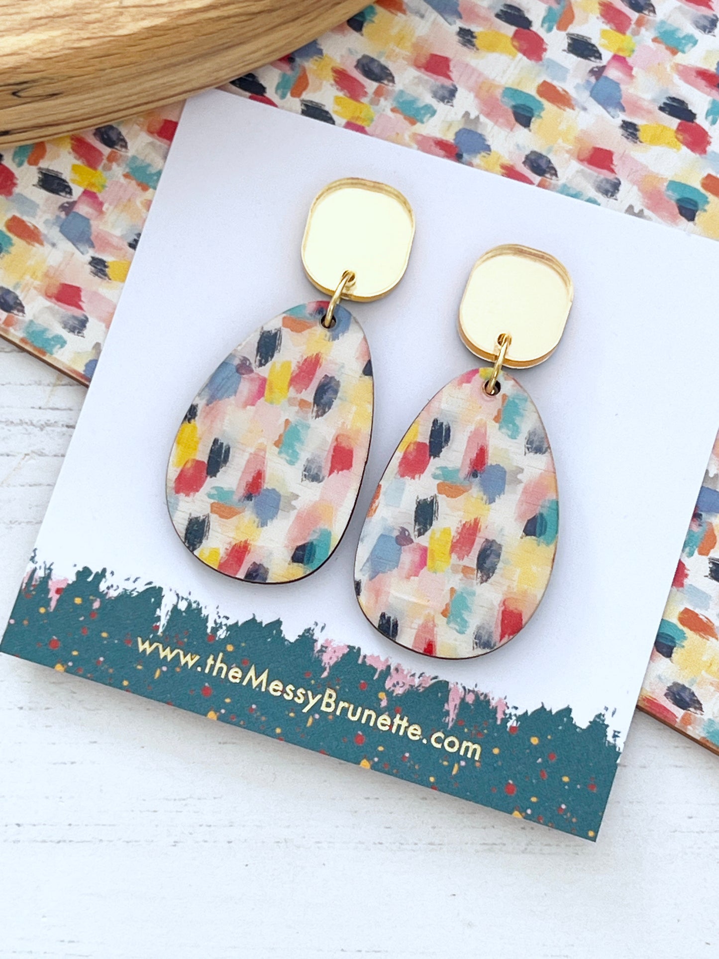 paint effect wooden earring on a card with the messy brunette branding