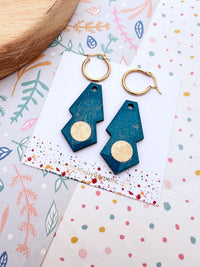 Glitter blue gatsby hoops earrings with 'The Messy Brunette' jewellery branded card on a colourful background