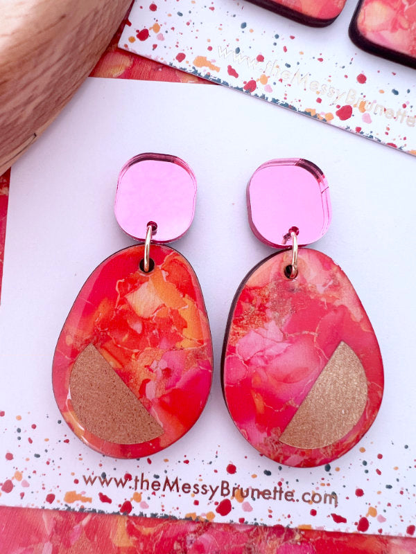 Pink and orange colour clash statement earrings