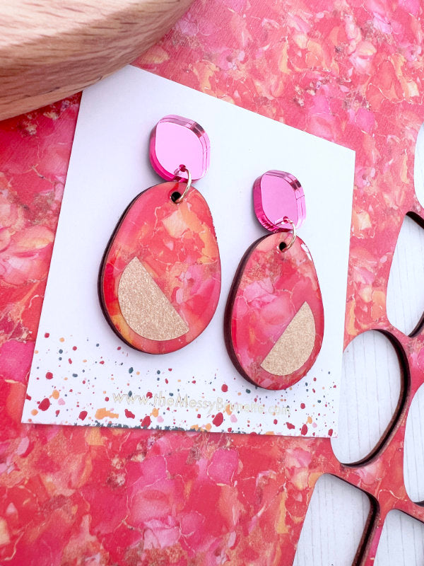 Pink and orange colour clash statement earrings