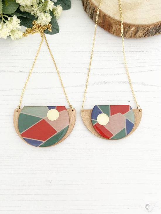 Geometric Wooden Necklace with shades of green, blue, red & pink.