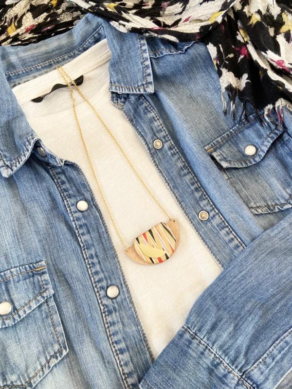 Gold Swirls Handmade Necklace made from FSC wood with gold swirls against black, white red stripes