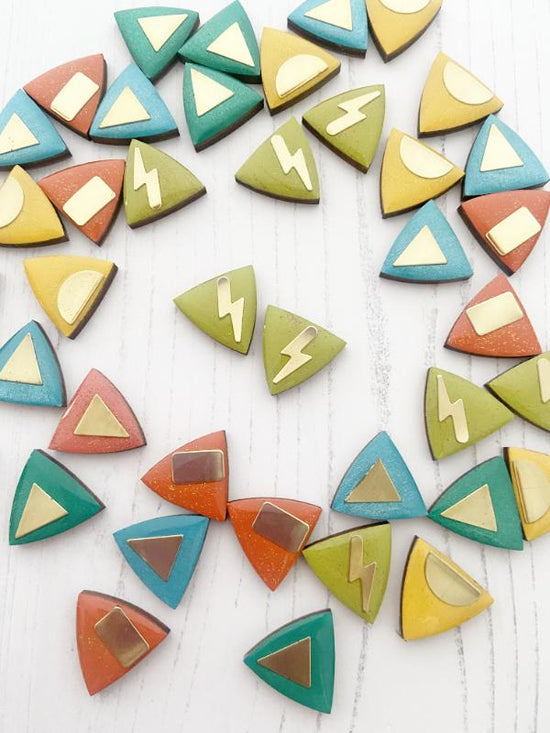 Load image into Gallery viewer, Hand painted triangle studs made from birch plywood.
